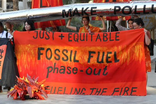 Demonstrators at COP28, by UNFCCC
